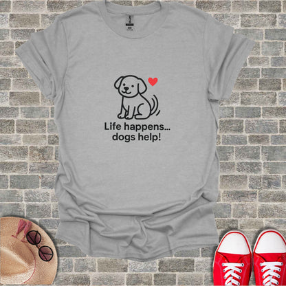 Grey t-shirt with a cartoon dog, red heart, and text "Life happens... dogs help!".