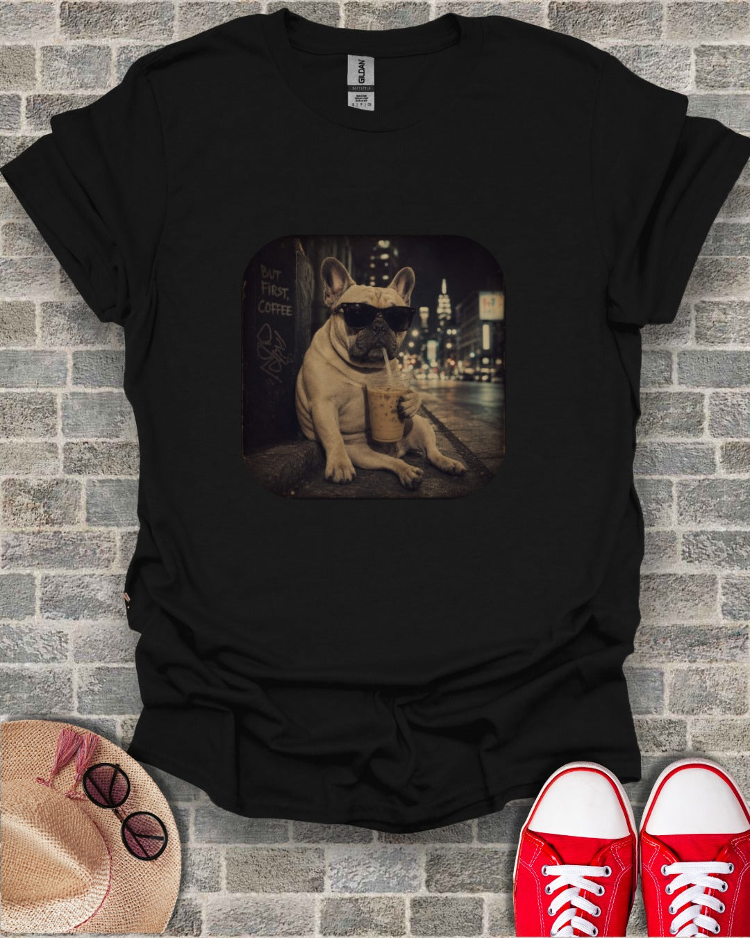 French bulldog wearing sunglasses drinks coffee with "But First, Coffee" text.
