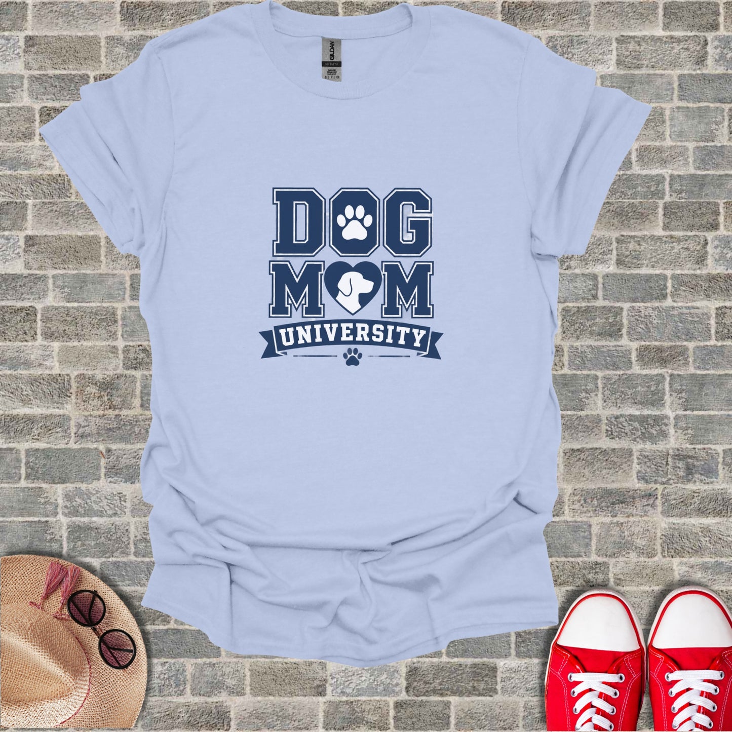 Light blue t-shirt with "DOG MOM UNIVERSITY" text and paw print logo.