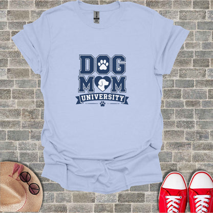 Light blue t-shirt with "DOG MOM UNIVERSITY" text and paw print logo.