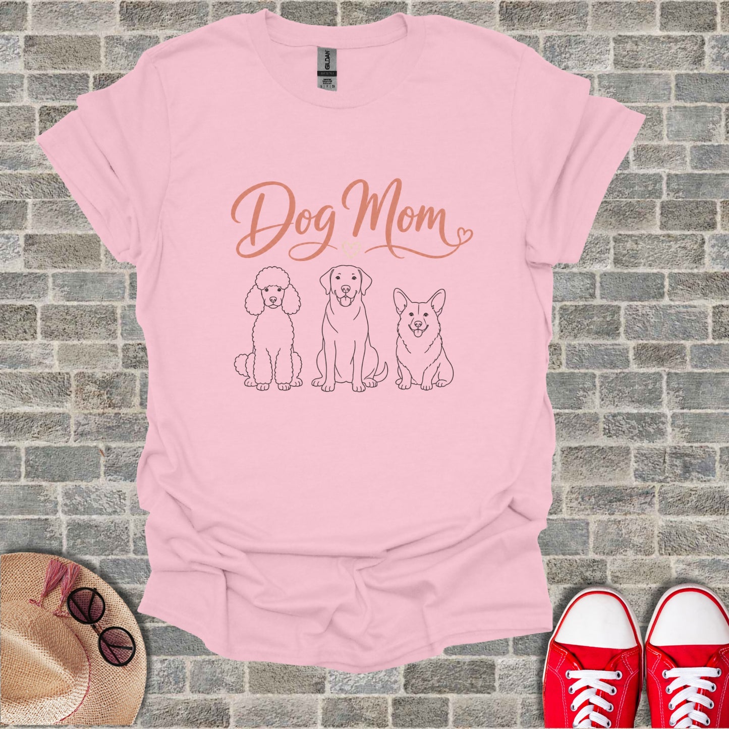 Pink t-shirt with "Dog Mom" text and line drawings of three dogs.