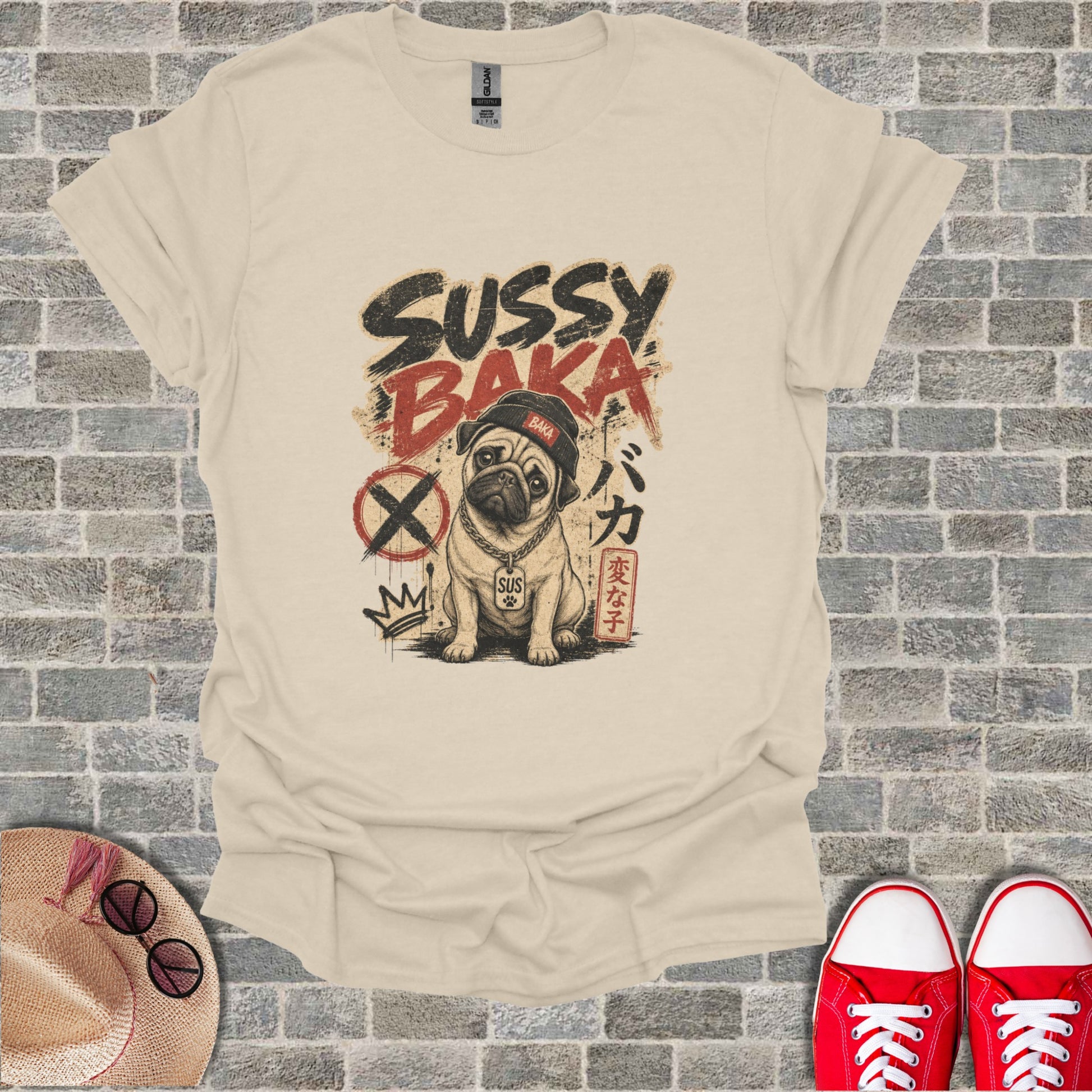 Tan t-shirt with a pug wearing a crown and "Sussy Baka" text.