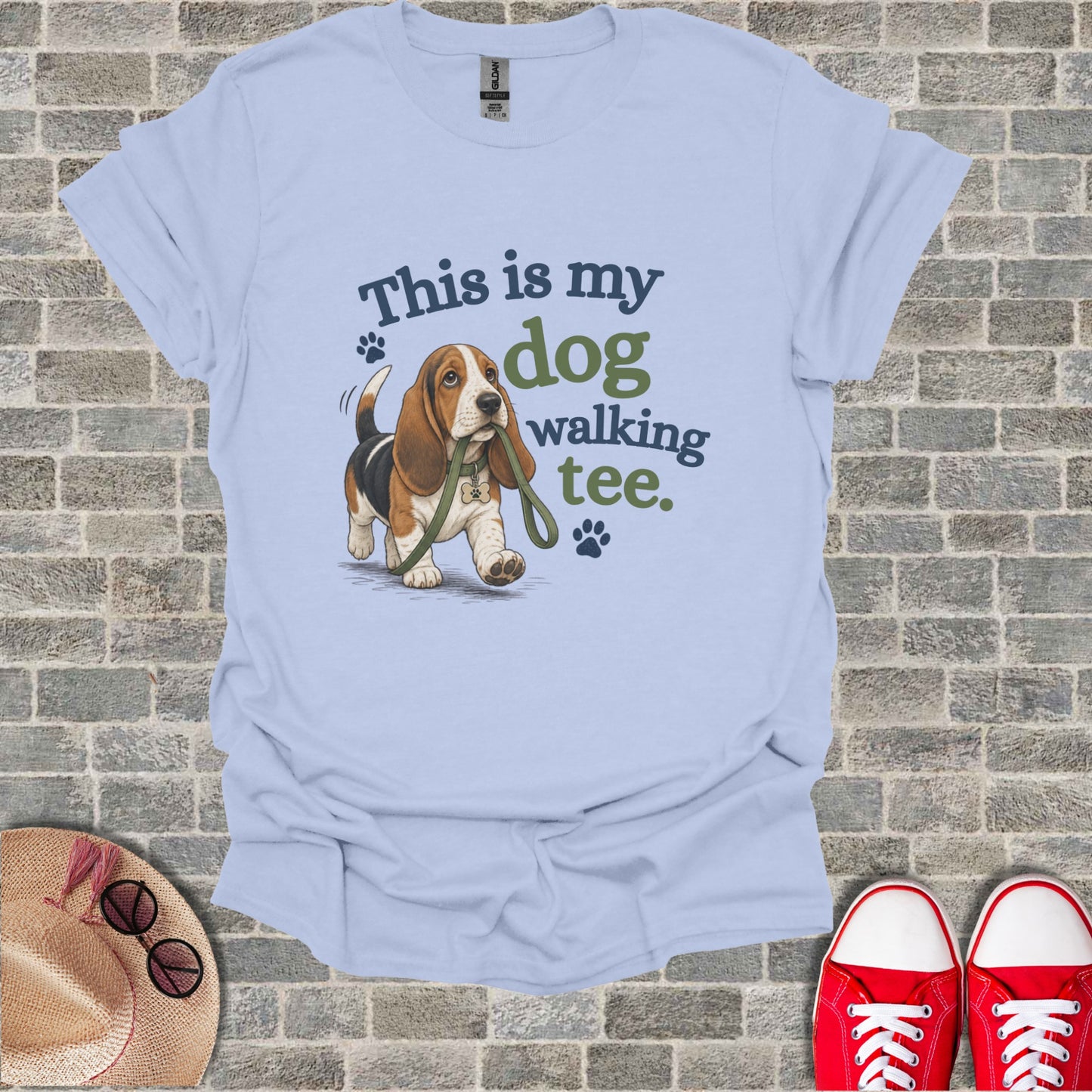 Light blue t-shirt with a Basset Hound and "This is my dog walking tee." text.