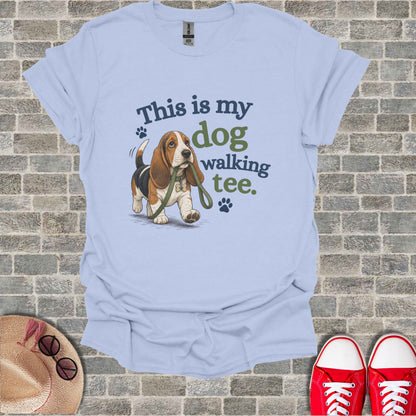 Light blue t-shirt with a Basset Hound and "This is my dog walking tee." text.