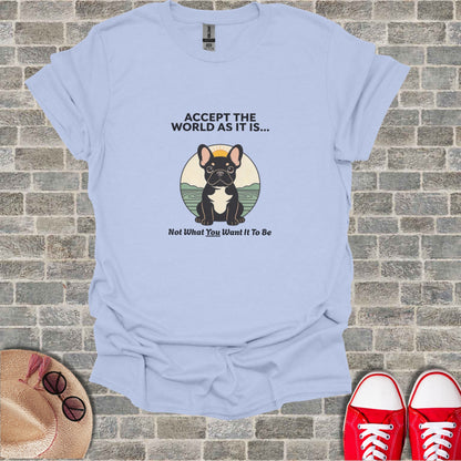 Light blue t-shirt with French bulldog and text "Accept the world as it is..."