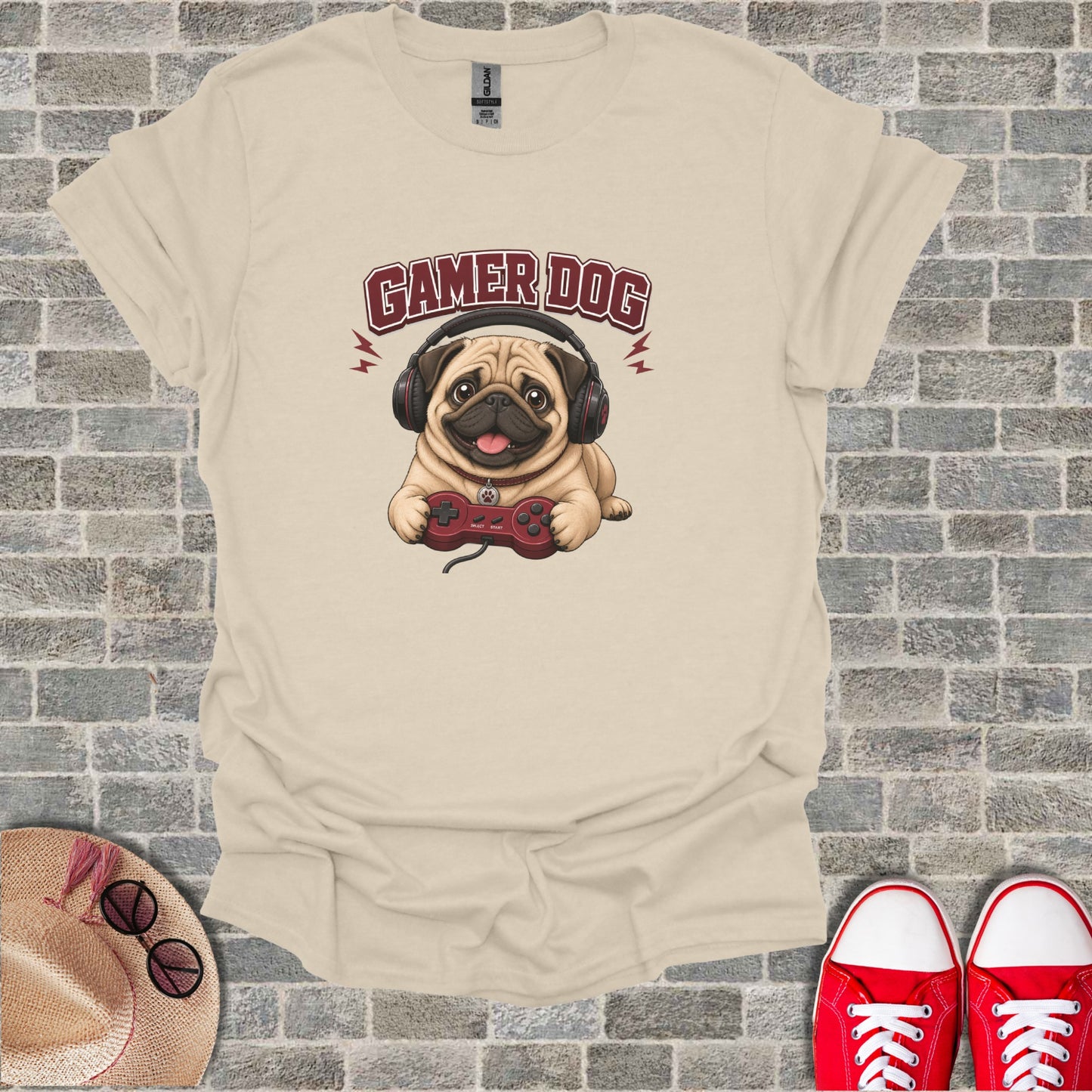 T-shirt with a pug wearing headphones playing a video game.