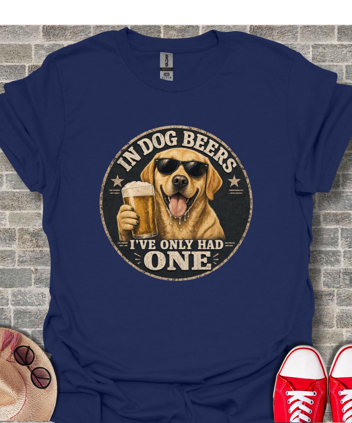 Labrador wearing sunglasses holds beer, "In dog beers I've only had one" text.
