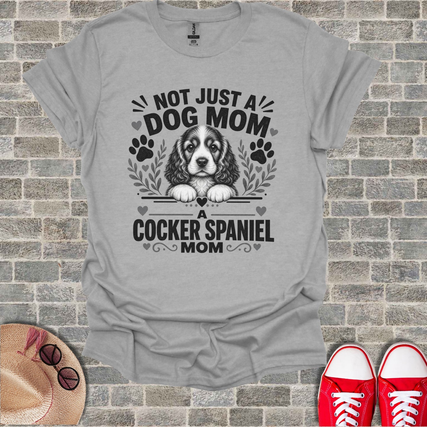 Grey t-shirt with "Not Just A Dog Mom" and Cocker Spaniel graphic.