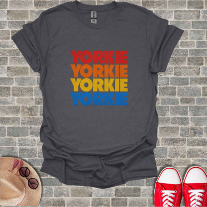 Dark gray t-shirt with "YORKIE" in red, orange, and yellow stacked text.