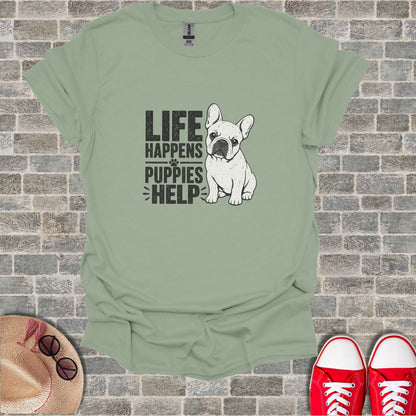 French Bulldog graphic on a light green t-shirt with text "Life Happens Puppies Help."