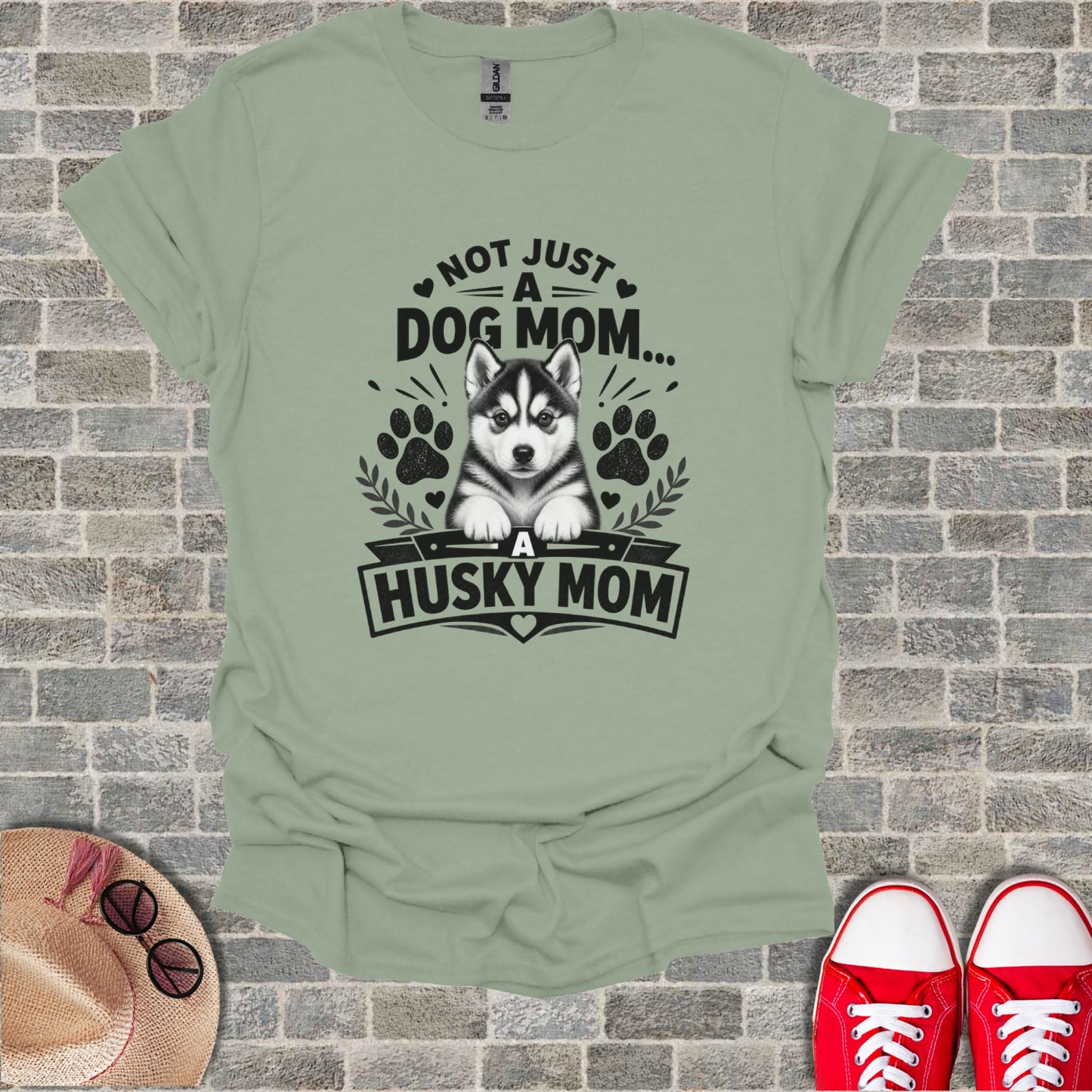 Light green t-shirt with "Not Just A Dog Mom... A Husky Mom" graphic and husky puppy.