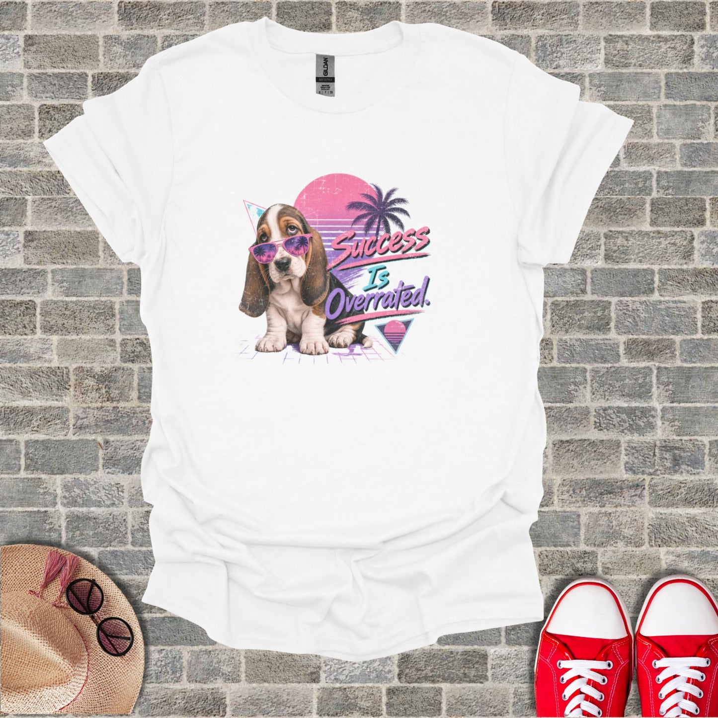 White t-shirt with a retro dog graphic and "Success Is Overrated" text.