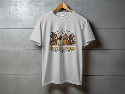 White t-shirt with four dachshunds dressed in Halloween costumes and "HAPPY HALLOWEENIE" text.