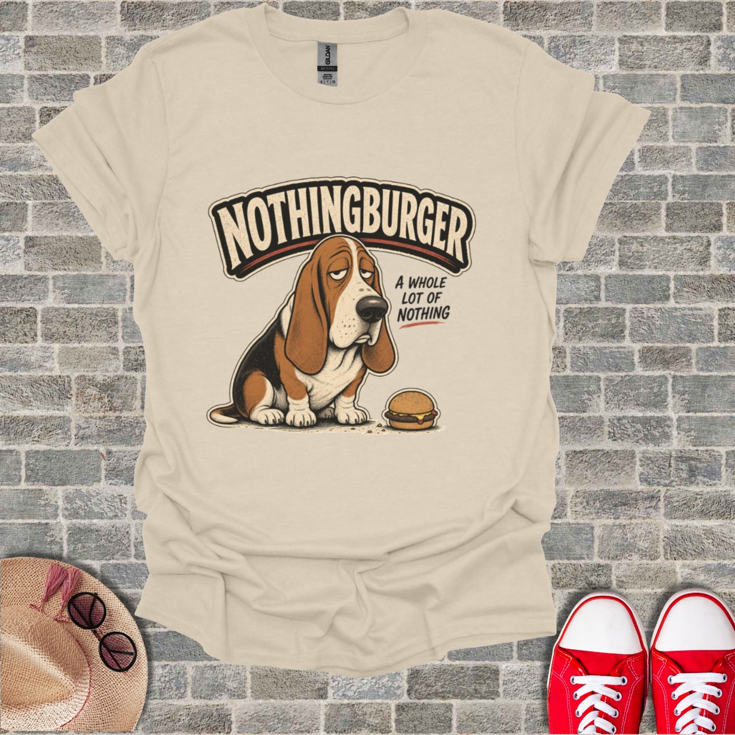Basset hound wearing t-shirt with "Nothingburger" and hamburger graphic.