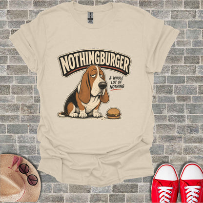 Basset hound wearing t-shirt with "Nothingburger" and hamburger graphic.