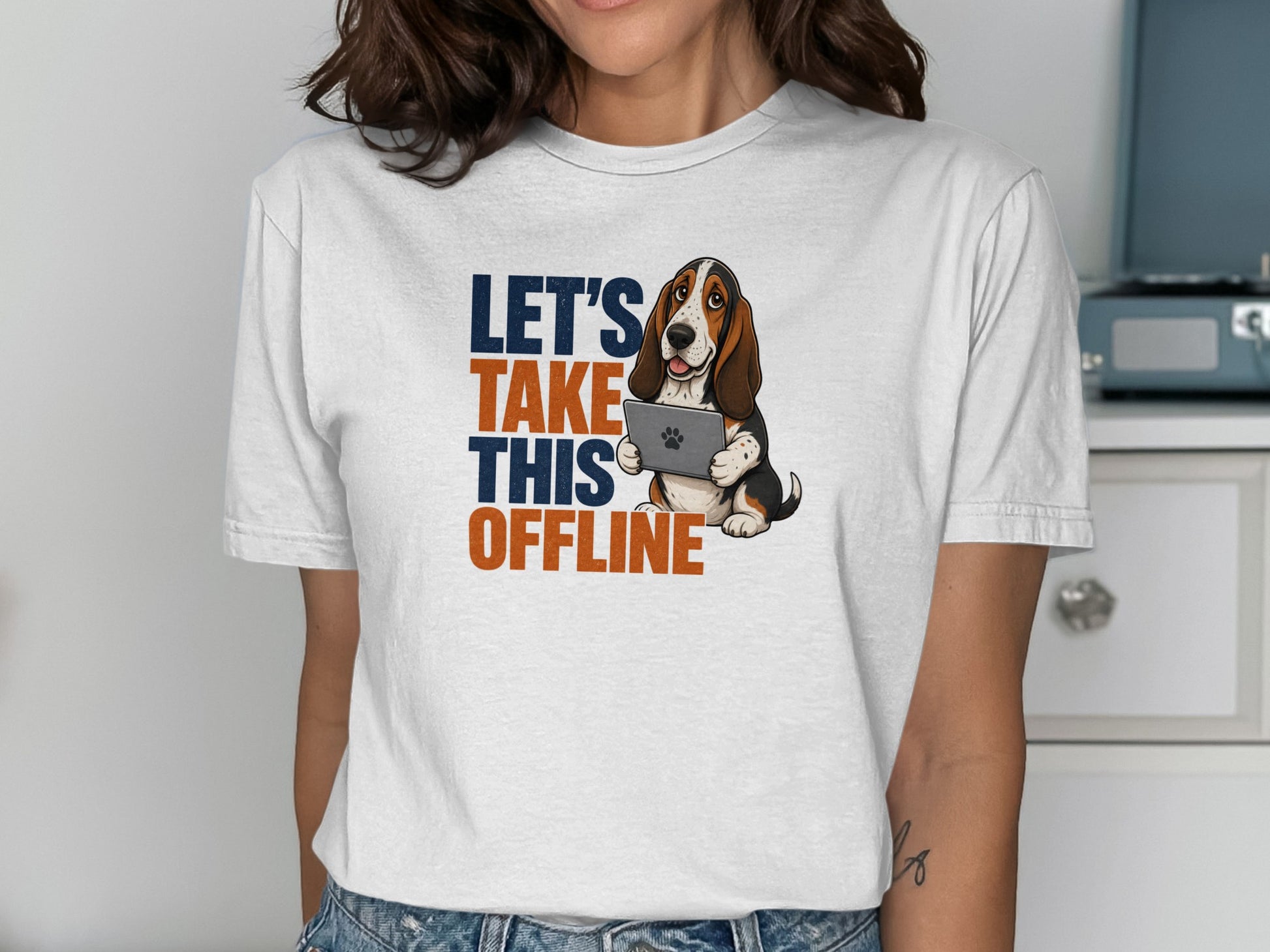 Basset hound in t-shirt holding a tablet with text "LET'S TAKE THIS OFFLINE".