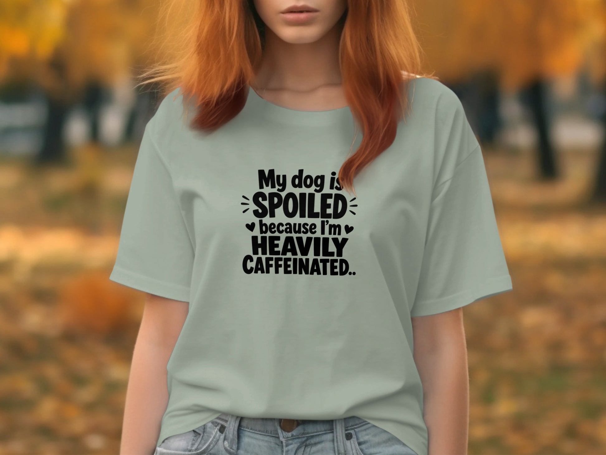 Light blue t-shirt with black text "My dog is SPOILED because I'm HEAVILY CAFFEINATED."