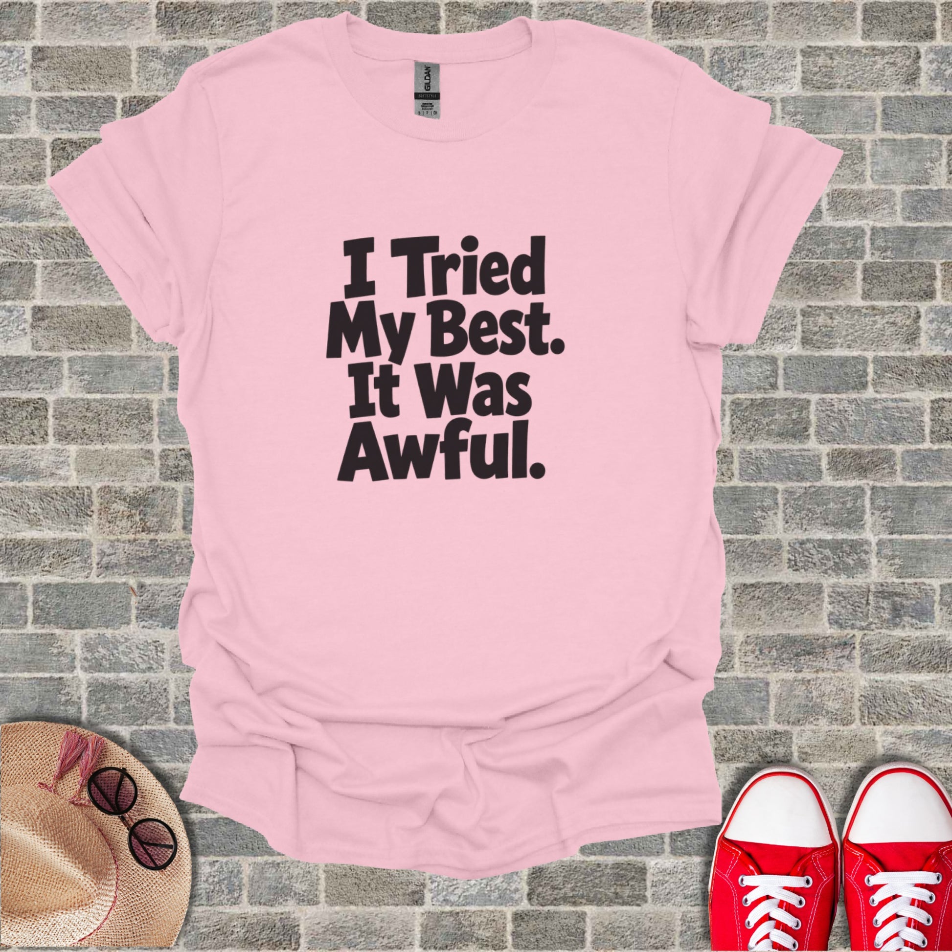 Pink t-shirt with "I Tried My Best. It Was Awful." text.