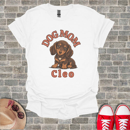 White t-shirt with "Dog Mom Cleo" and a dachshund illustration.