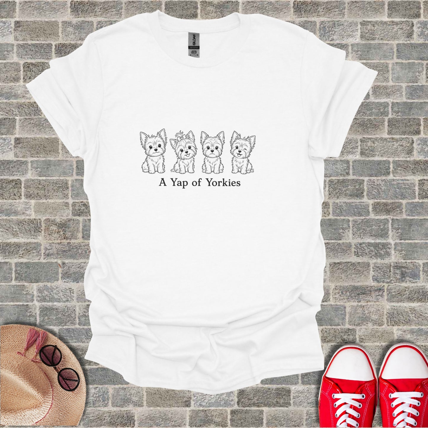 White t-shirt with line drawing of four Yorkshire terriers and text "A Yap of Yorkies".