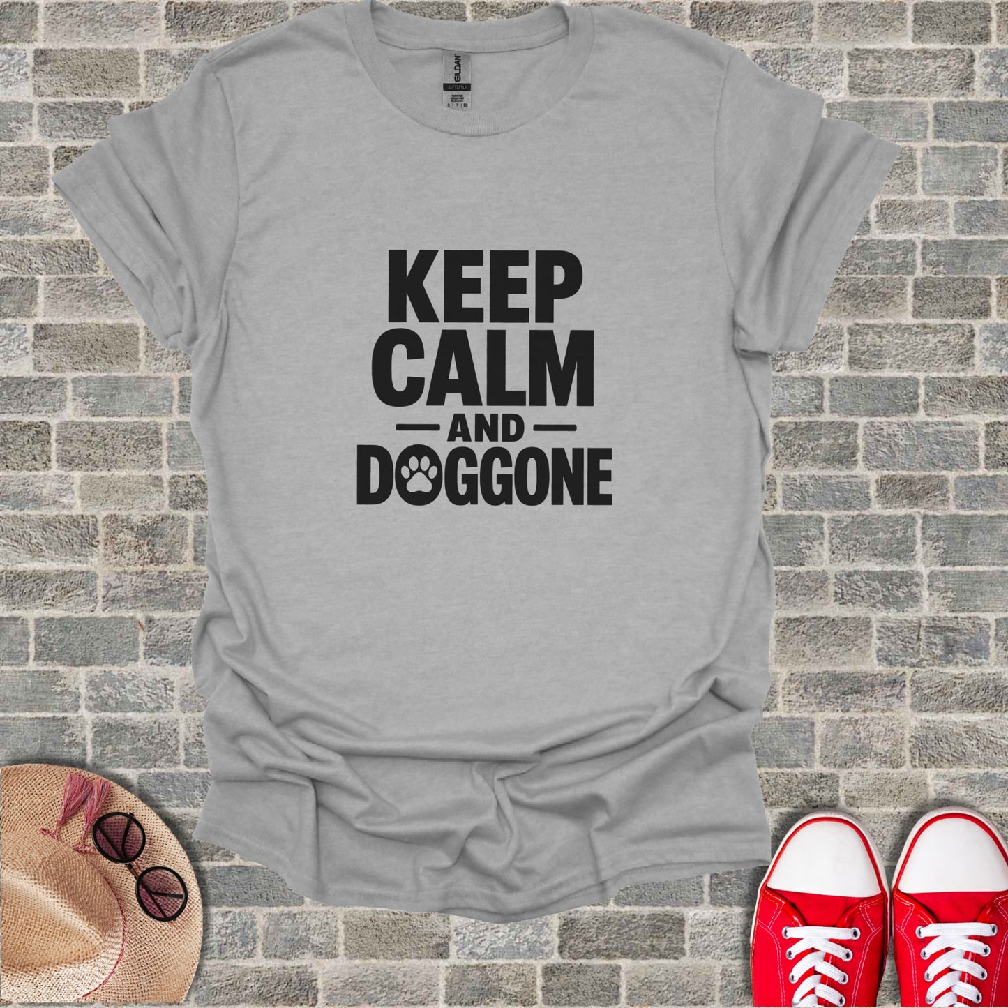 Grey t-shirt with "KEEP CALM AND DOGGONE" text and a paw print.