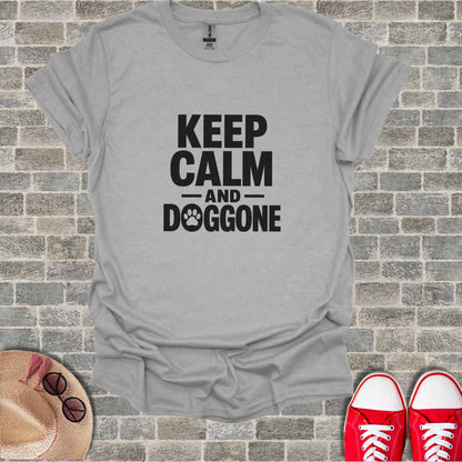Grey t-shirt with "KEEP CALM AND DOGGONE" text and a paw print.