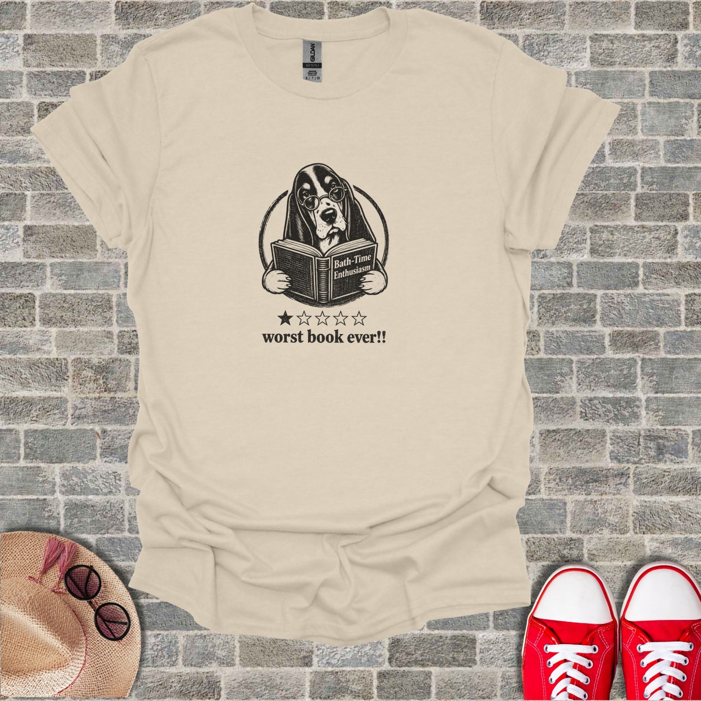 T-shirt with a cartoon dog wearing glasses, reading a book with a rating.