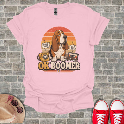 Basset hound wearing glasses with "OK BOOMER" text and retro items.