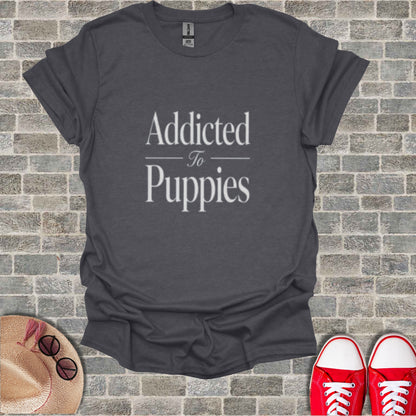 Dark grey t-shirt with "Addicted to Puppies" text.