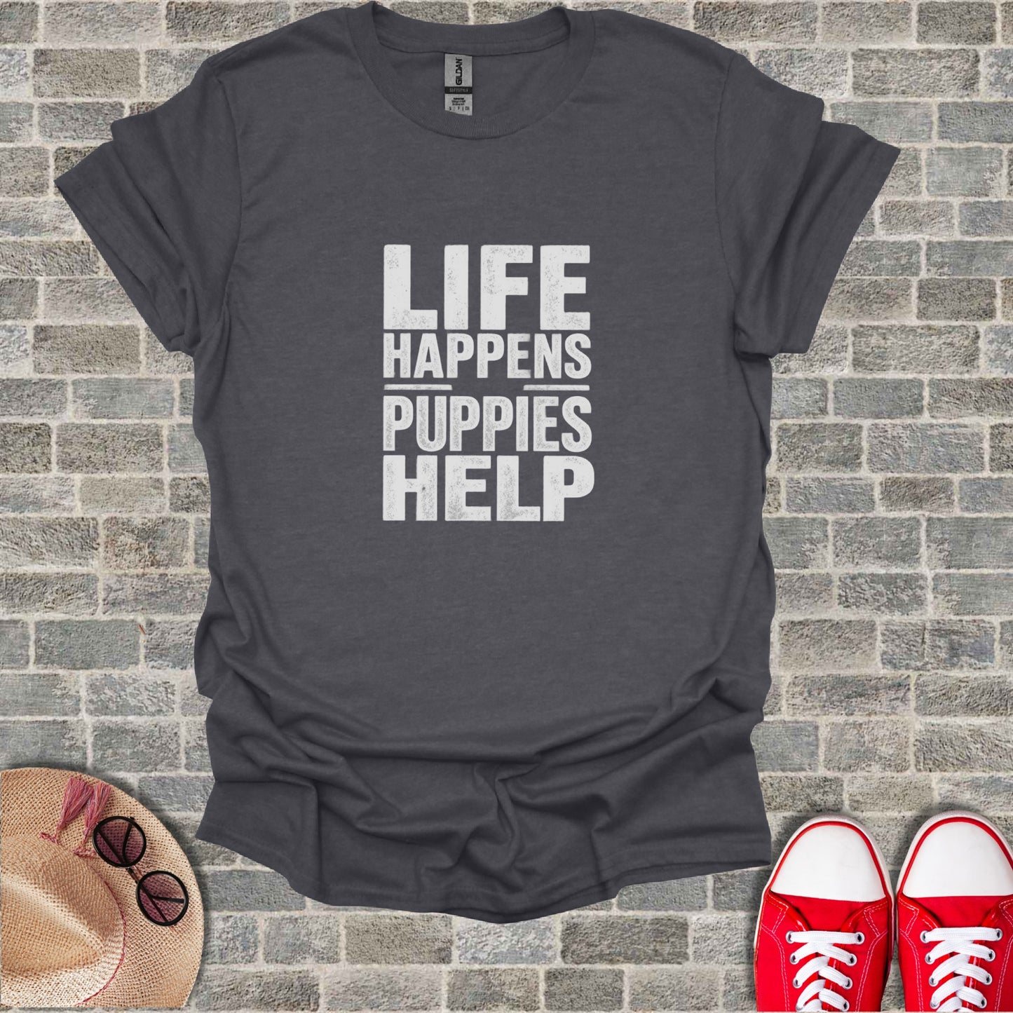 Dark grey t-shirt with "LIFE HAPPENS PUPPIES HELP" text.