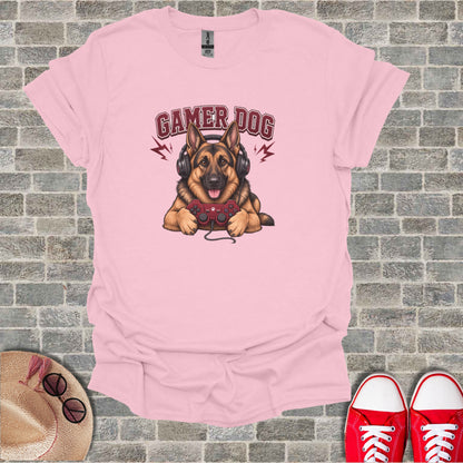 Pink t-shirt with cartoon dog wearing headphones and holding a game controller.