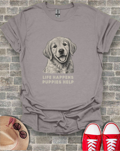 Grey t-shirt with sketch of happy golden retriever and text "LIFE HAPPENS PUPPIES HELP".