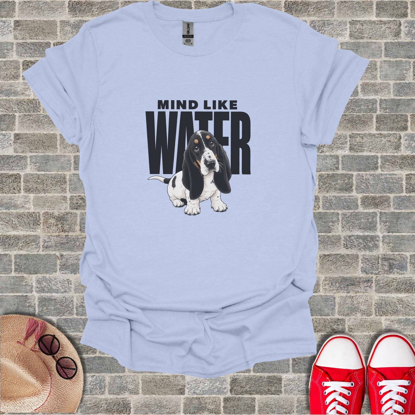 Light blue t-shirt with black text "MIND LIKE WATER" and a basset hound graphic.