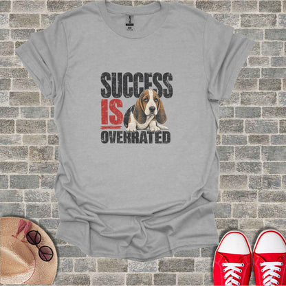 Gray t-shirt with a distressed graphic of a basset hound and text "SUCCESS IS OVERRATED".