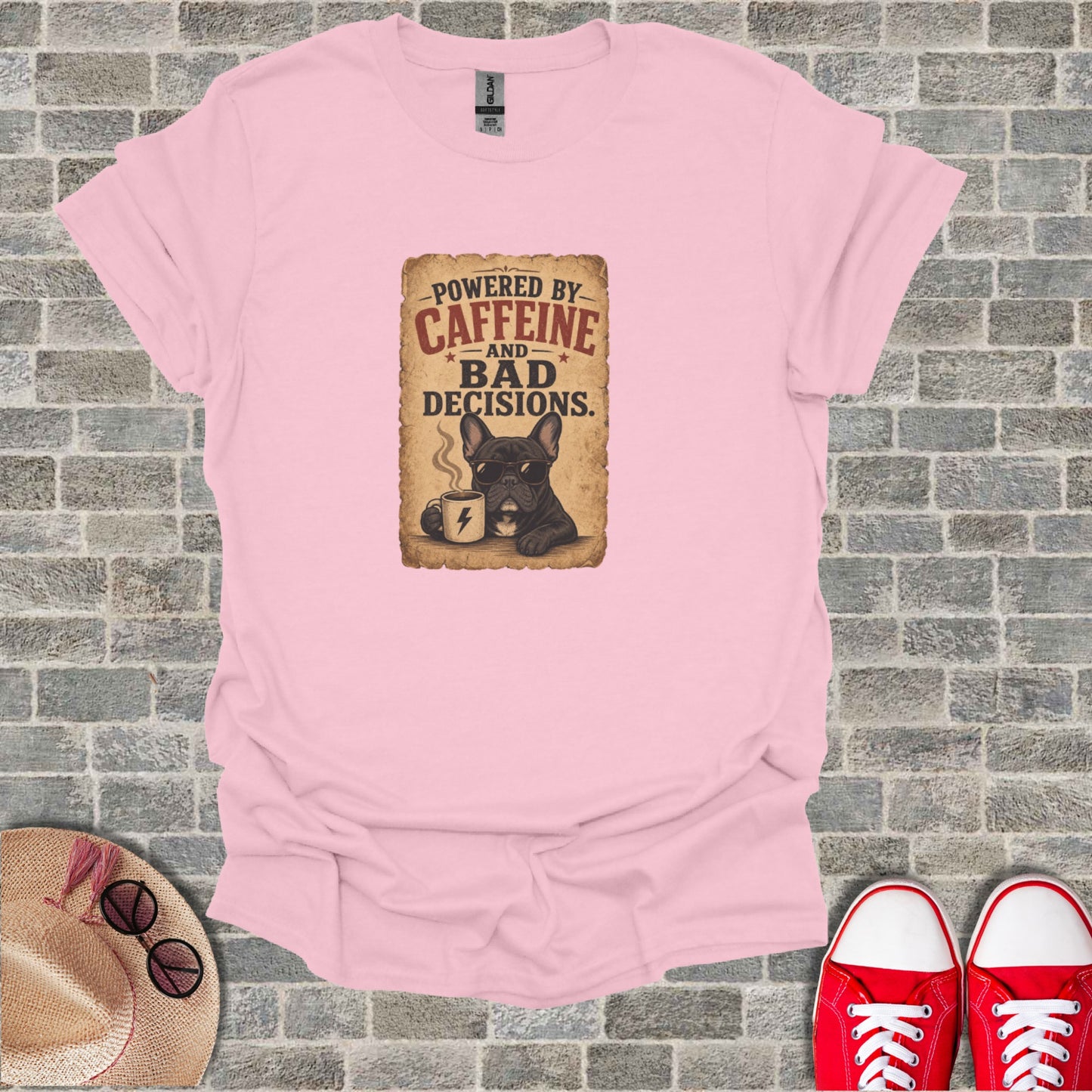 Pink t-shirt with French bulldog drinking coffee, text says "Powered by Caffeine and Bad Decisions."