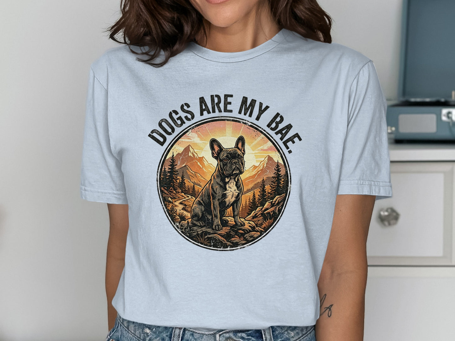 French bulldog in mountain landscape with "Dogs are my Bae" text.