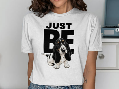 White t-shirt with "JUST BE" text and a cute basset hound puppy.