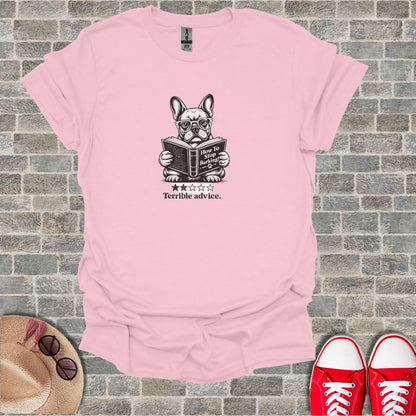 French bulldog wearing glasses reads "How to Stop Barking!" book.