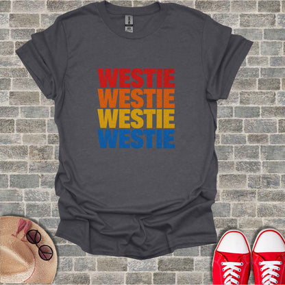 Dark grey t-shirt with "WESTIE" in stacked red, orange, and yellow text.