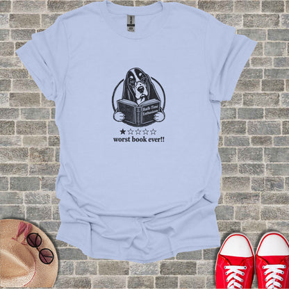 Basset hound in glasses reading a book, with "Worst Book Ever!!" text.