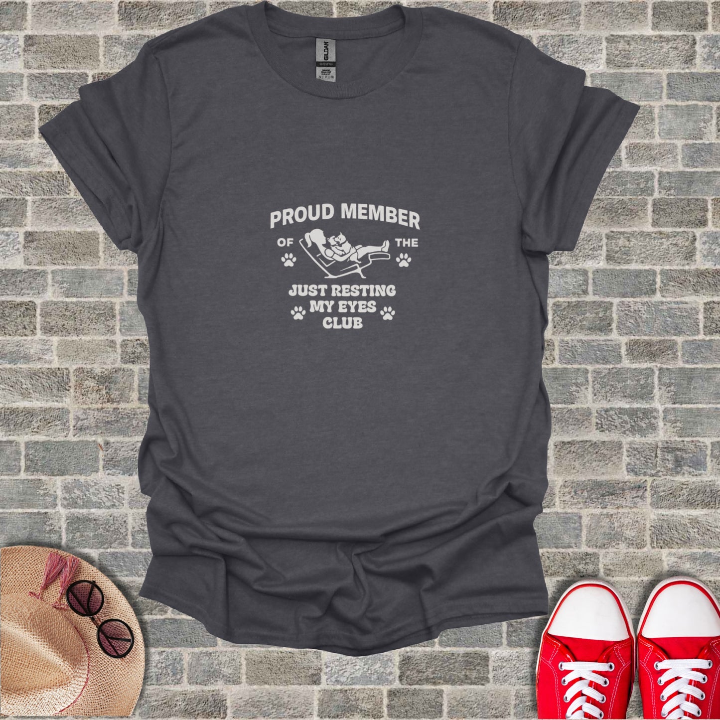 Dark grey t-shirt with "Proud Member of the Just Resting My Eyes Club" text and paw prints.