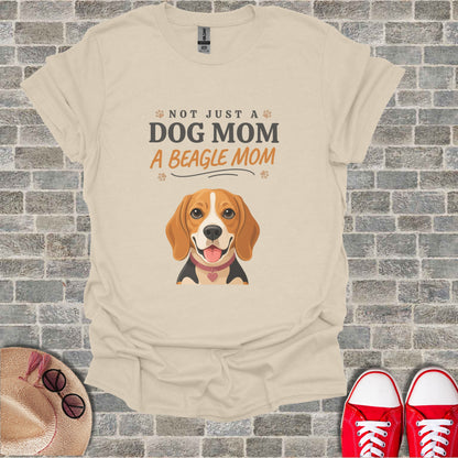Light beige t-shirt with beagle graphic and text "Not Just a Dog Mom, A Beagle Mom."