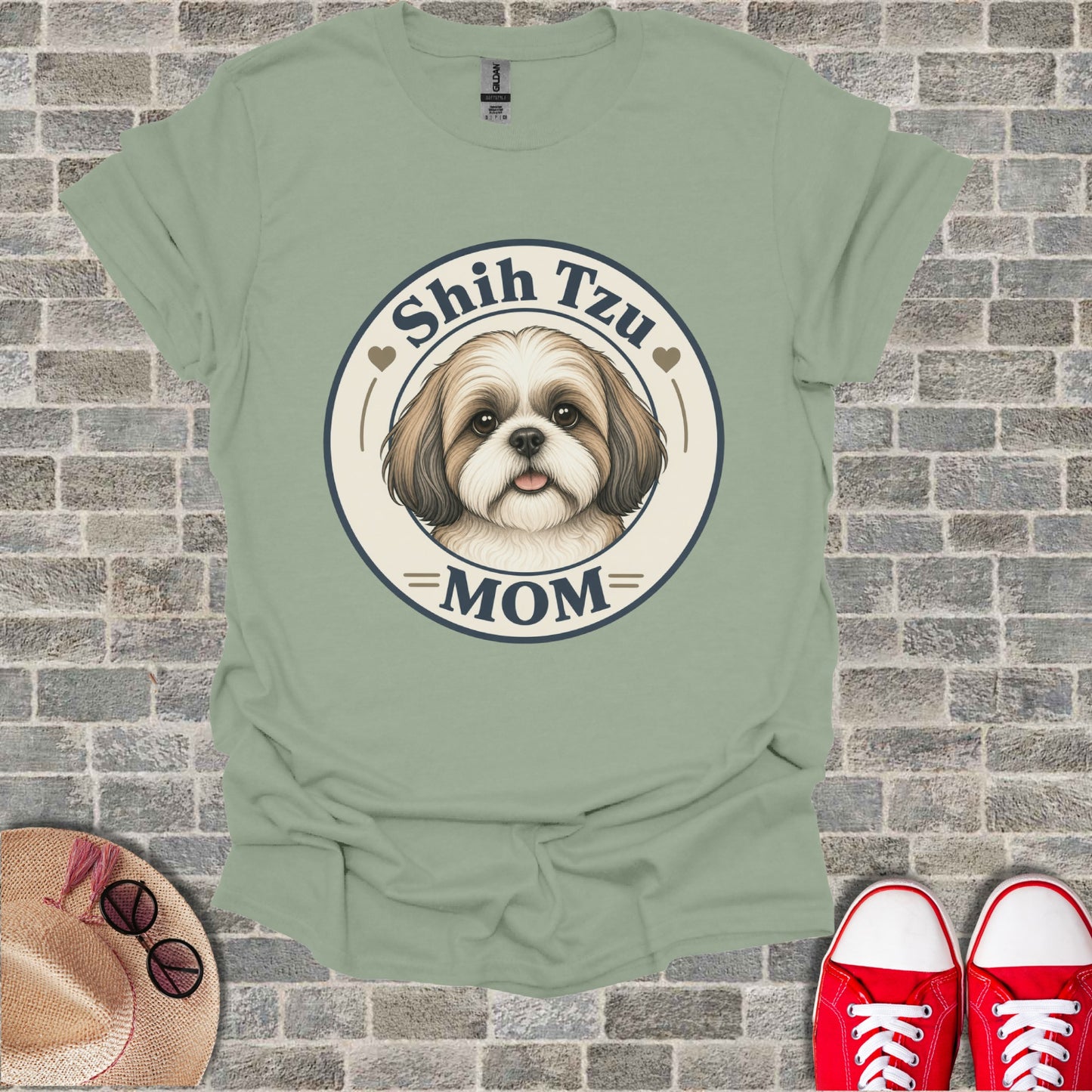 Shish Tzu Mom graphic t-shirt with dog face and text on pale green shirt.