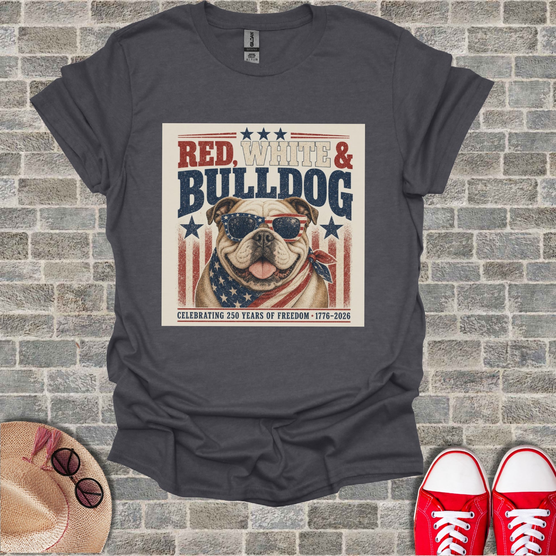 Bulldog wearing sunglasses and bandana on t-shirt, "Red, White & Bulldog" text.