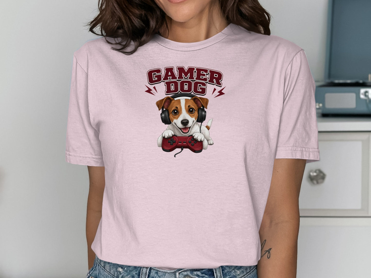 Pink t-shirt with a Jack Russell Terrier wearing headphones and holding a video game controller.