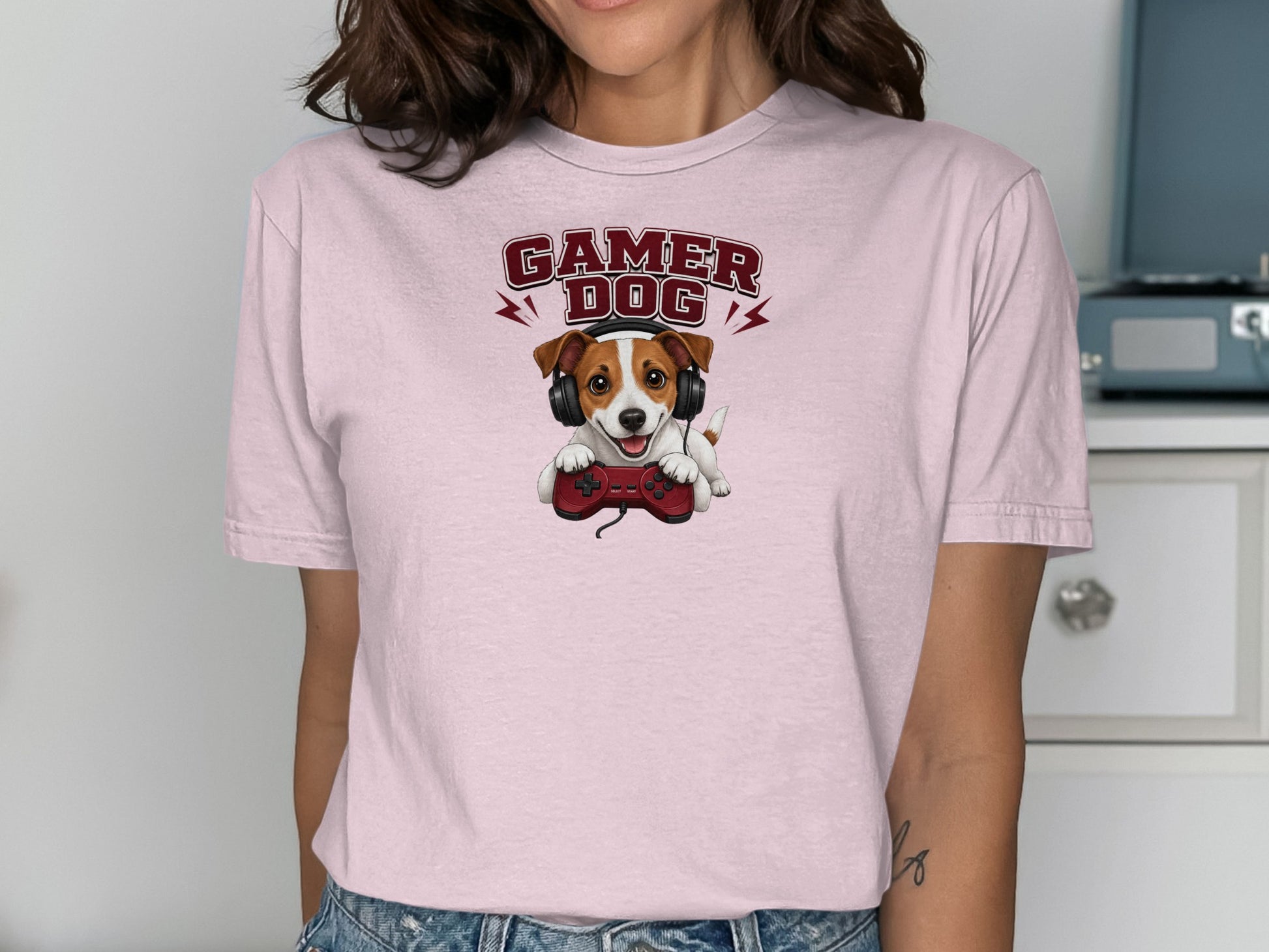 Pink t-shirt with a Jack Russell Terrier wearing headphones and holding a video game controller.