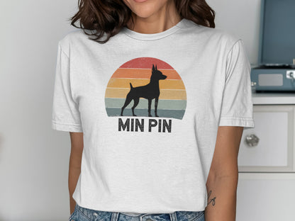 Silhouette of a Min Pin dog against a sunset graphic and "MIN PIN" text.