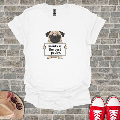 White t-shirt with pug holding sign that says "Beauty is the best policy."