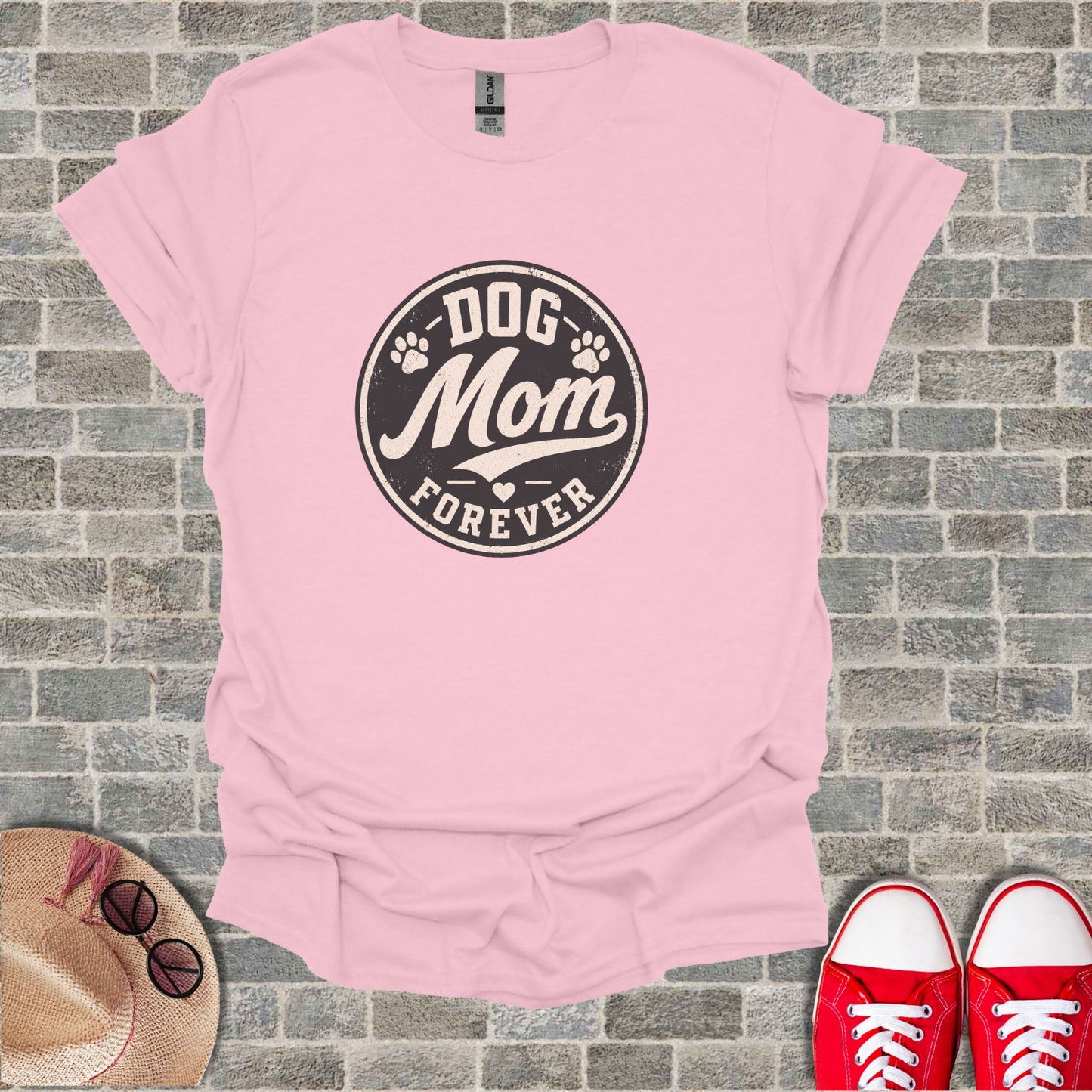 Pink t-shirt with "Dog Mom Forever" circular graphic and paw prints.