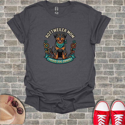 Rottweiler mom wearing bandana, framed by flowers and text.